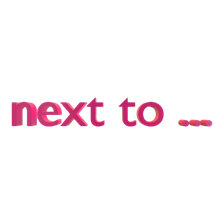 next to